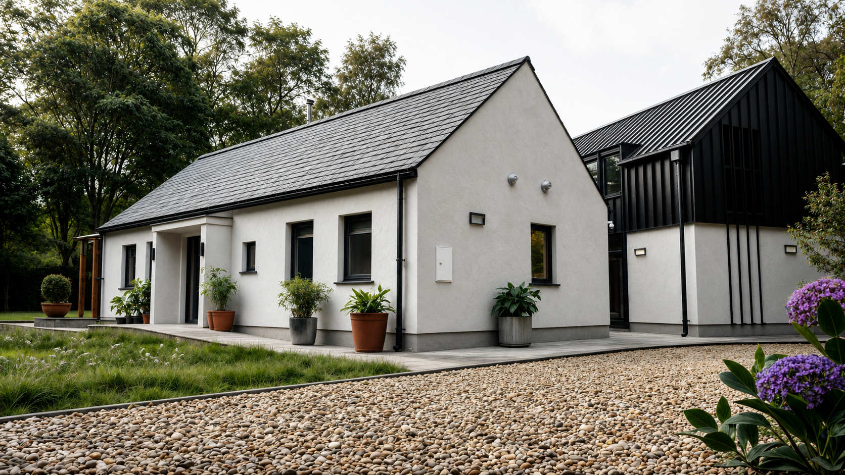 New build contemporary home by Usonia Architects in Donegal combining traditional Irish cottage architecture with a modern two-storey barn-style extension in a woodland setting.