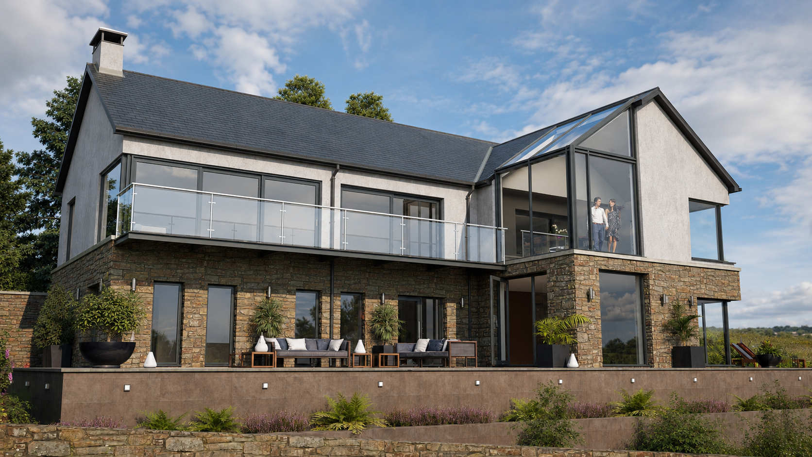Contemporary house in Donegal with natural stone walls, white render, slate roofs and large glazed gable overlooking the landscape.